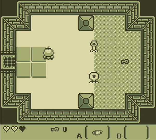 A dungeon room with two round enemies and a key on the floor